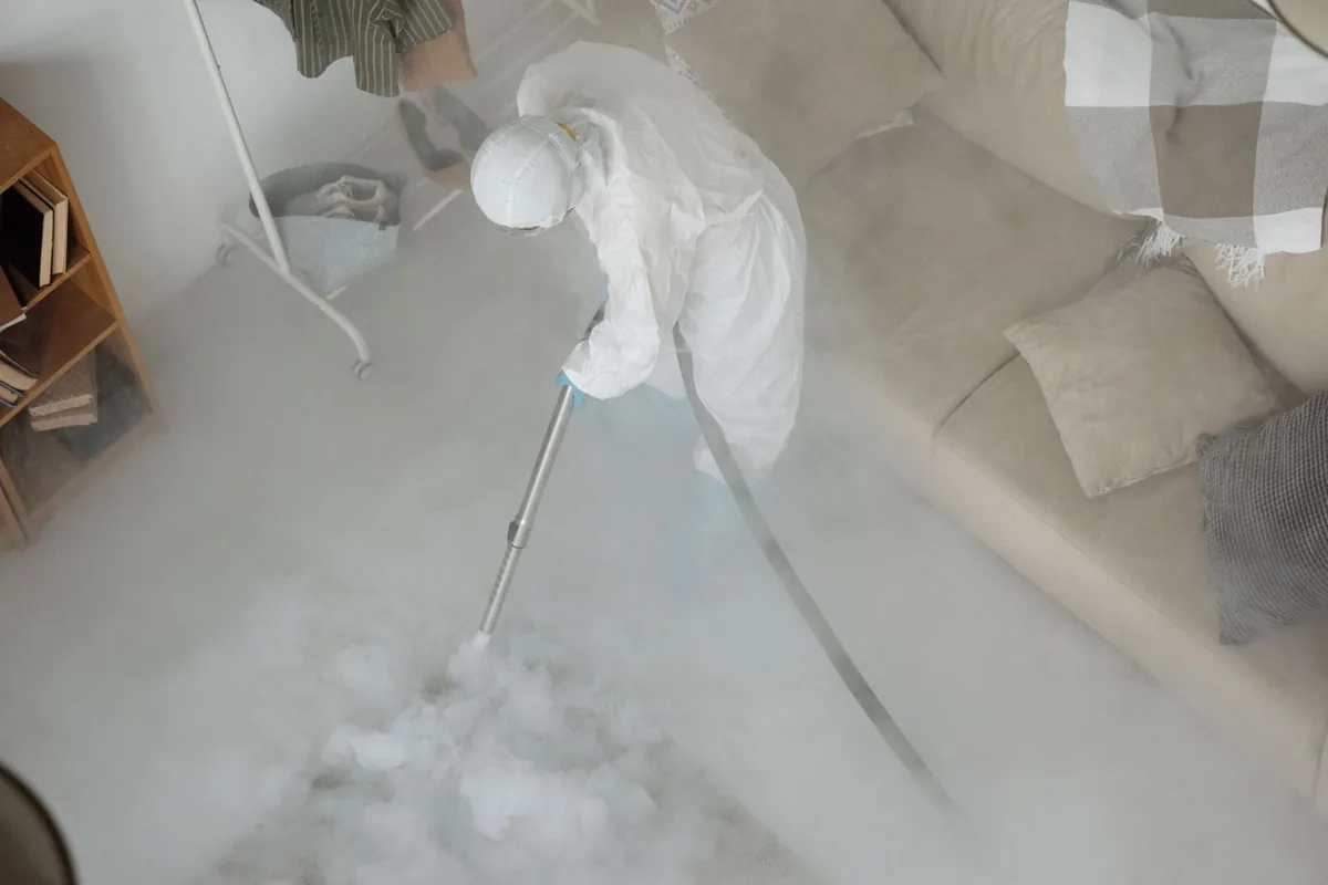 Biohazard cleanup technician in protective equipment, Daleville, VA